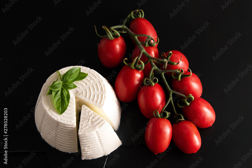 Ταπετσαρία Front view view of fresh ricotta cheese with basil and cherry tomatoes on black plate italian food concept