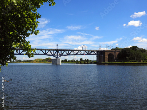 railway road over the river the meuse in Wezet, Belgium photo