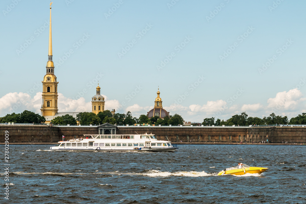 Peter and Paul fortress the Neva river in St. Petersburg. Tourists and people visiting the fortress and the architecture of the city