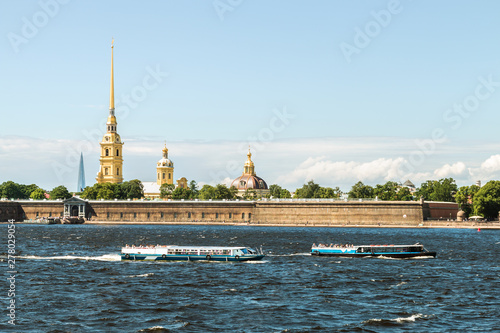 Peter and Paul fortress the Neva river in St. Petersburg. Tourists and people visiting the fortress and the architecture of the city photo