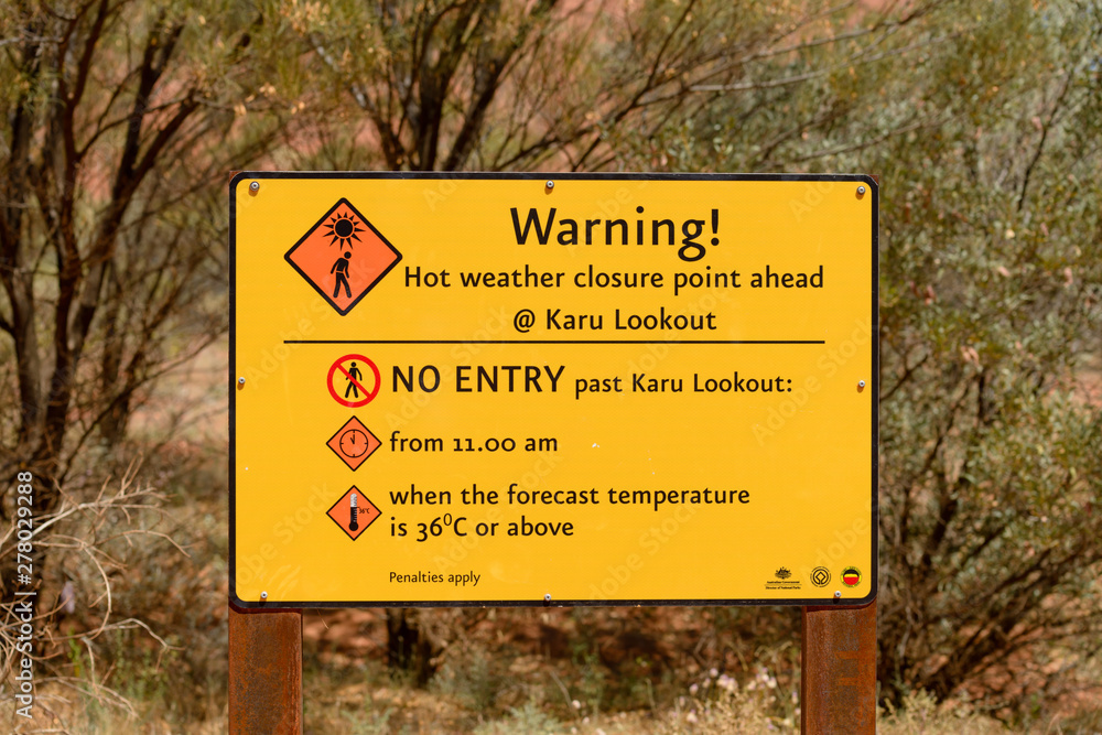 A hot weather warning sign close to Uluru, Ayres Rock, in Australia.