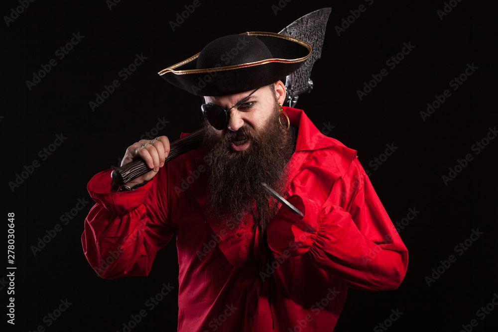 Portrait of a medieval bearded pirate on black background. Portrait of a medieval bearded pirate on black background.
