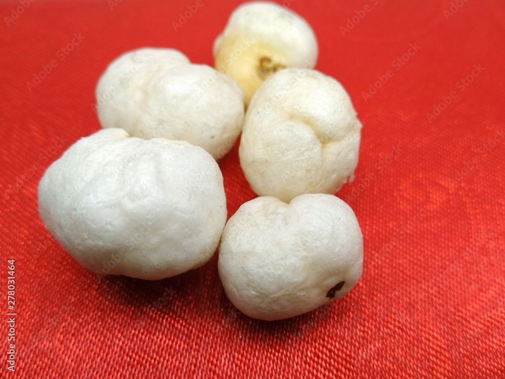 A picture of dry fruit on red background A picture of dry fruit on red background