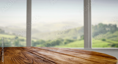 Wooden table background in the window sunshine in the summer © magdal3na