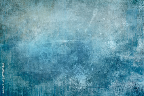 Splattered blue paint on a canvas, grungy background or texture