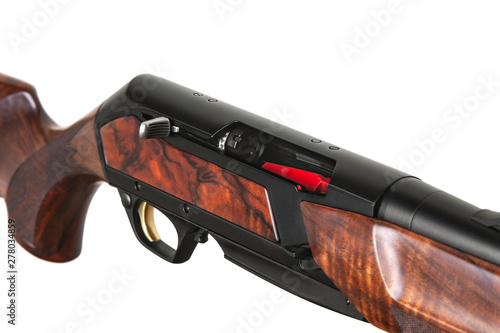 Modern semi-automatic hunting rifle with a wooden butt isolate on a white background