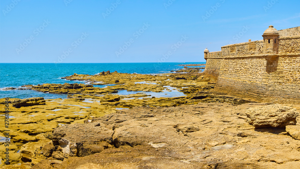 San Sebastian Castle, the ancient Phoenician Temple to Moloch / Kronos. View from Paseo Fernando Quinones Promenade. Cadiz. Andalusia, Spain.