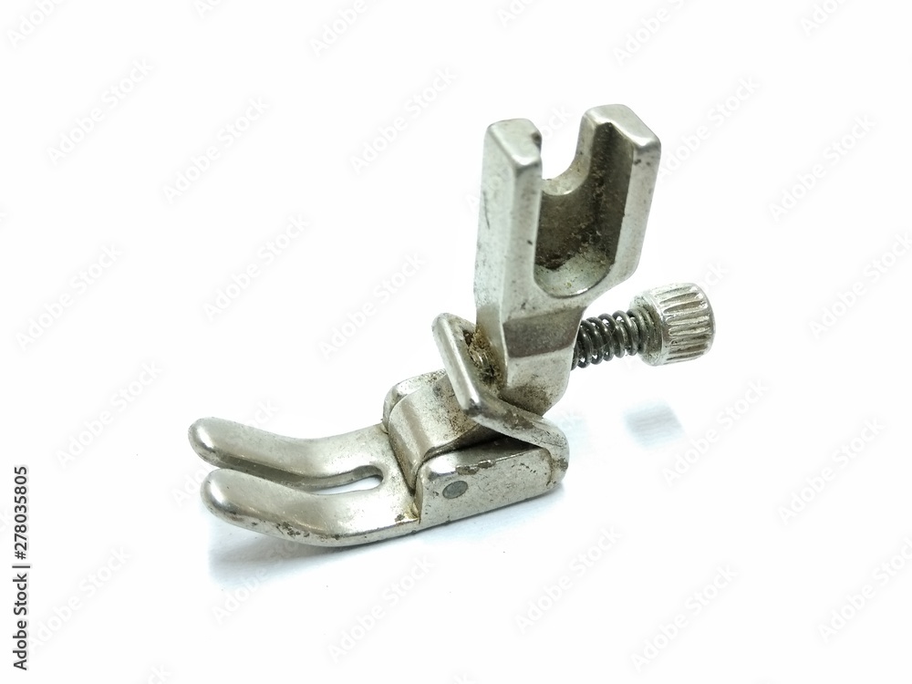 A picture of sewing machine part isolated on a white background A picture of sewing machine part isolated on a white background