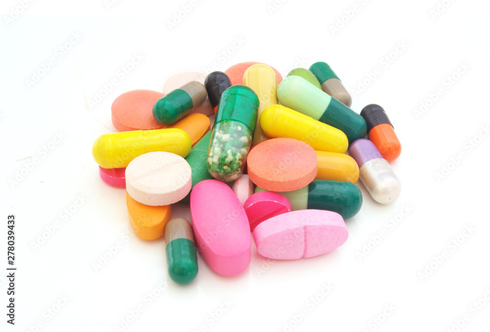 Medication and healthcare concept. Many colorful tablets, pills, drugs isolated on white background Medication and healthcare concept. Many colorful tablets, pills, drugs isolated on white background