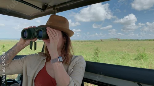 Wallpaper Mural Woman on a safari trip in Masai Mara park, Kenya Torontodigital.ca