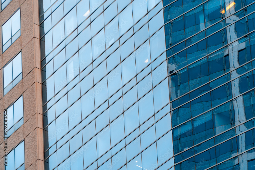 Blue windows of office building close up. Real estate lease concept.