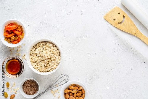 Ingredients for cooking homemade granola (muesli). Healthy breakfast.