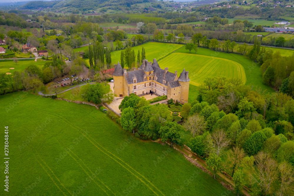 Aerial view of Castle of Montal in Saint-Jean-Lespinasse, Lot department. Southern France. The outdoor sculptures also make Montal a truly unique château