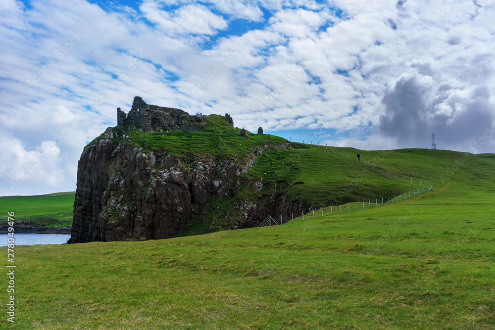 Duntulm Castle , the ruined castle on the north coast of Trotternish on the Isle of Skye in summer , Scotland