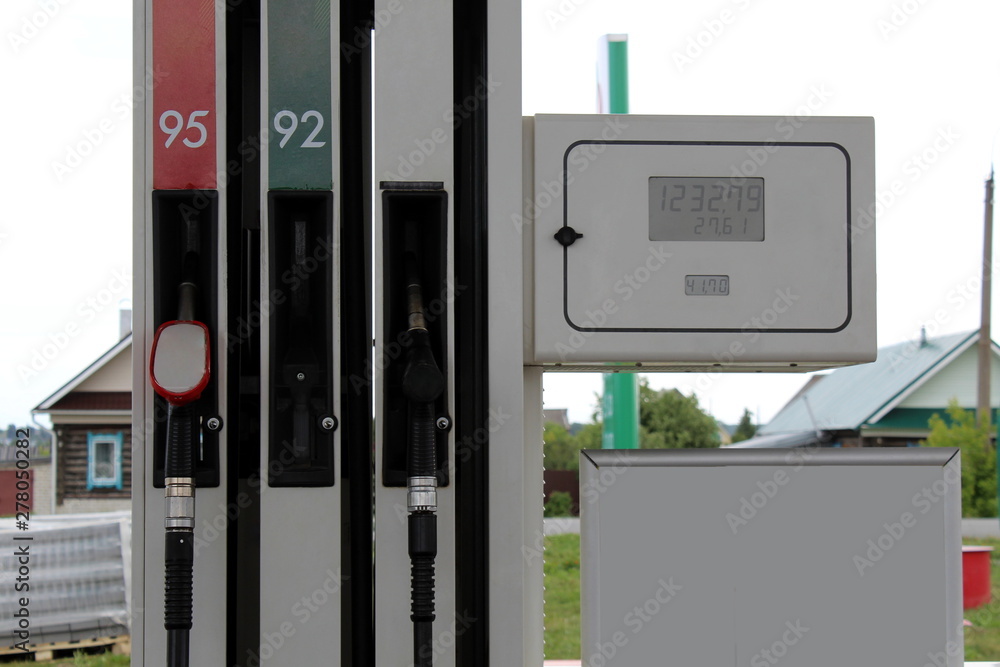 Gas station of gasoline fuel pump, gas pump nozzles at the station Gas station of gasoline fuel pump, gas pump nozzles at the station