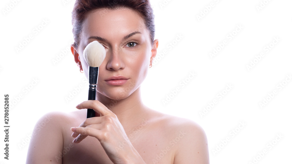 Cute brunette woman with natural make up. Clean flawless fresh skin. Close up beauty concept of skincare. She holds make up brush in her hand Cute brunette woman with natural make up. Clean flawless fresh skin. Close up beauty concept of skincare. She holds make up brush in her hand