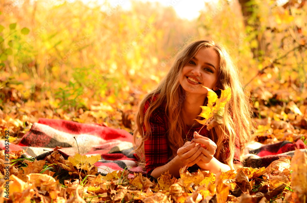 Outdoor fashion photo of young beautiful lady surrounded autumn leaves Outdoor fashion photo of young beautiful lady surrounded autumn leaves