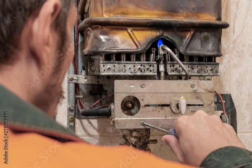 master performs maintenance of the gas boiler.