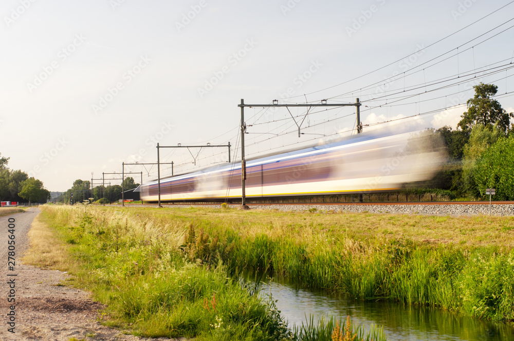 Dutch railway train with speed, with long exposure. Dutch railway train with speed, with long exposure.