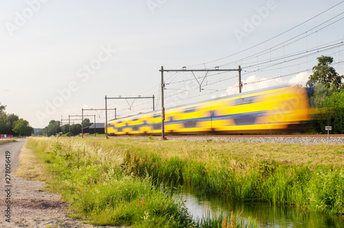 Obraz na płótnie Dutch railway train with speed, with long exposure.