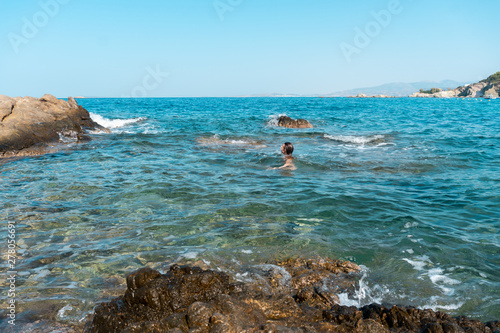 Cutie girl having fun in sea summer time