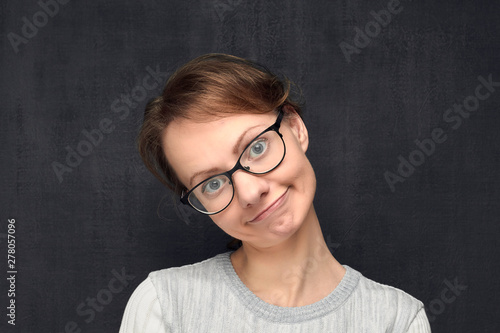 Portrait of cute and funny young woman making childish face