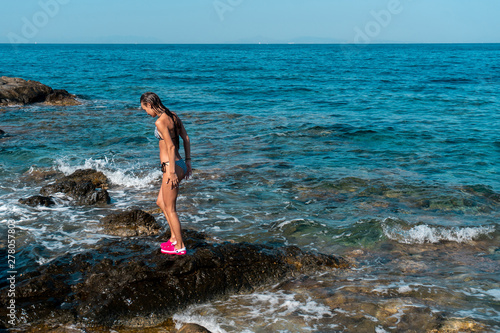 Cutie girl having fun in sea summer time