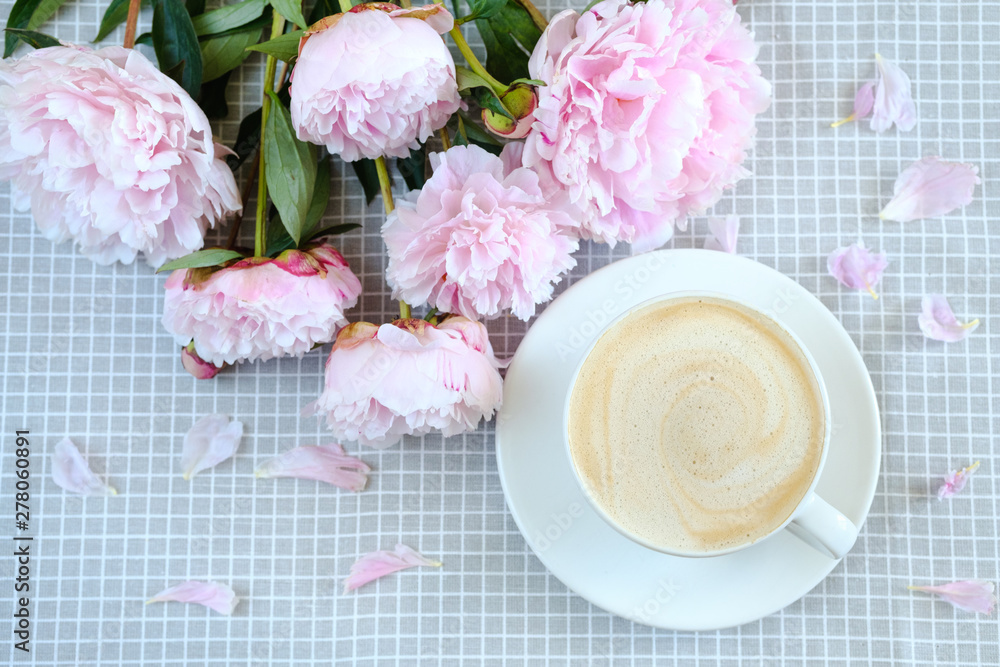 morning oatmeal cappuccino on a gray napkin in peonies morning oatmeal cappuccino on a gray napkin in peonies