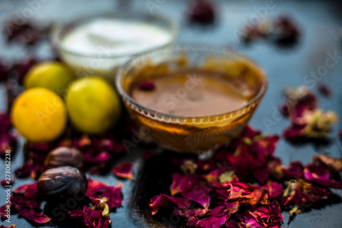 Nutmeg face mask to treat to even out discolorations and pigmentation on your face on the wooden surface consisting of Nutmeg powder, lemon juice, and curd.