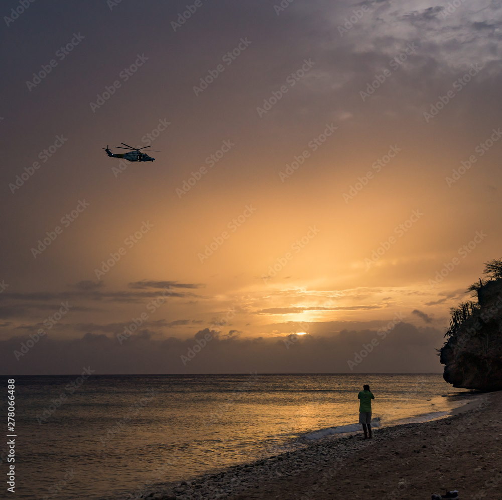 A fantastic sunset at the beach with a bonfire and BBQ on the island of Curacaio