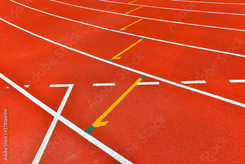 Red running track in stadium.  © piyaphong