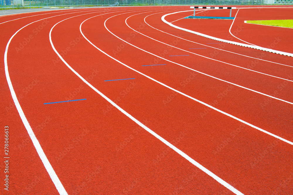Red running track in stadium. 