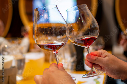 Professional wine tasting, sommelier course, looking at red dry wine in wine glass