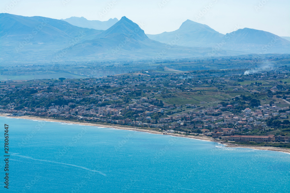 View on golden sandy coastline near small Sicilian seaside town Castellammare del Golfo located in western part of island