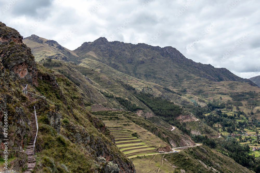 Landscape with green Andean Mountains and Inca ruins on the hiking path in Pisac archeological park, Peru Landscape with green Andean Mountains and Inca ruins on the hiking path in Pisac archeological park, Peru