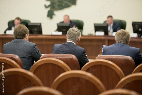 Session of Government. Conference room or seminar meeting room in business event. Academic classroom training course in lecture hall. blurred businessmen talking. modern bright office indoor