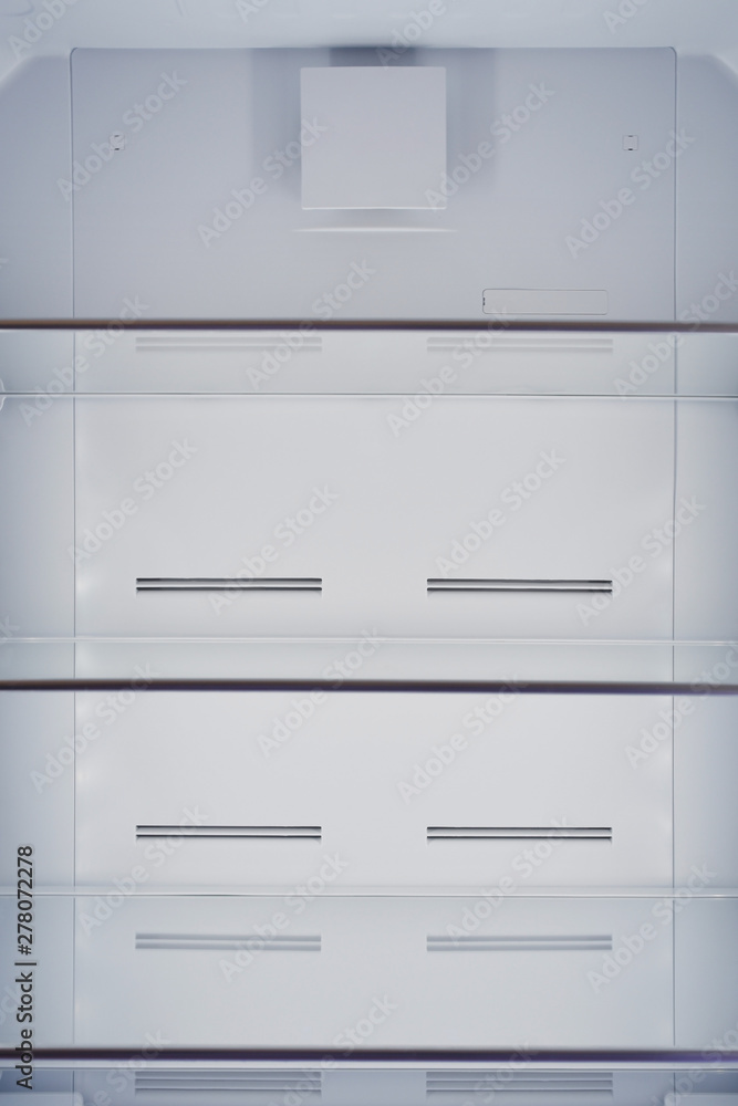 Inside of empty and clean modern refrigerator Inside of empty and clean modern refrigerator
