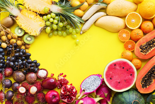 Fototapeta Naklejka Na Ścianę i Meble -  Rainbow different tropical fruit round fram yellow