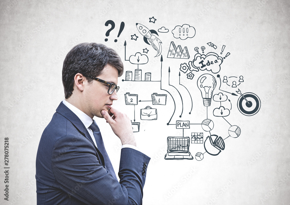 Thoughtful businessman in glasses, business plan Thoughtful businessman in glasses, business plan
