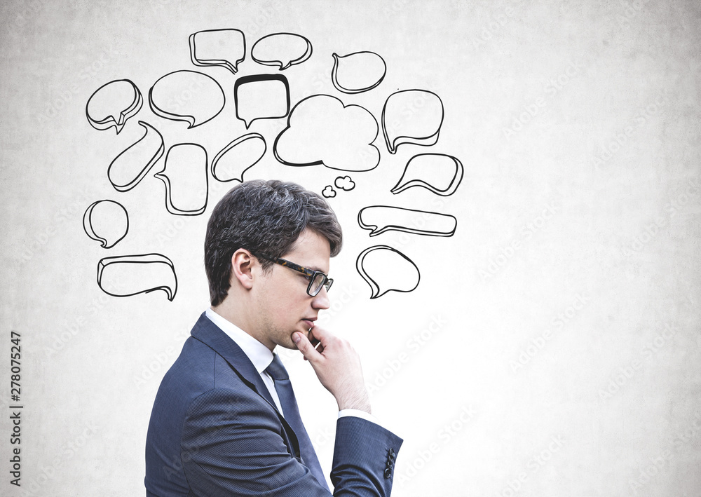 Pensive businessman in glasses, speech bubbles Pensive businessman in glasses, speech bubbles
