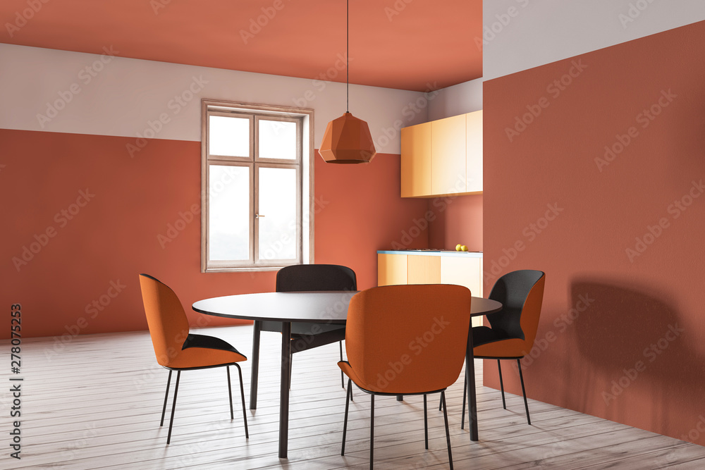 Fototapeta premium Orange kitchen corner with round table