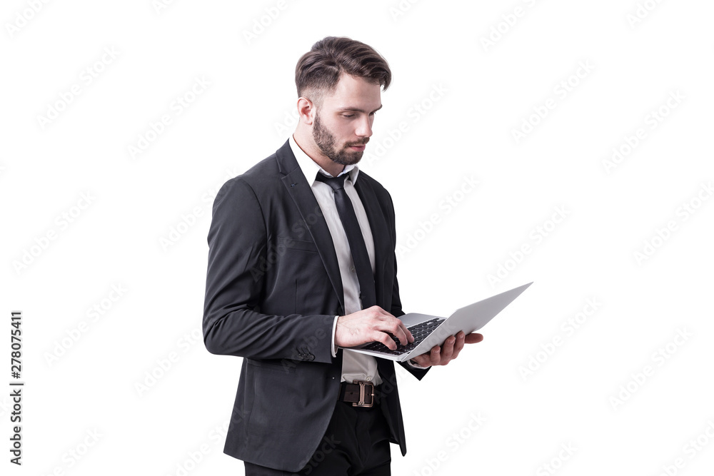 Serious businessman using laptop, isolated