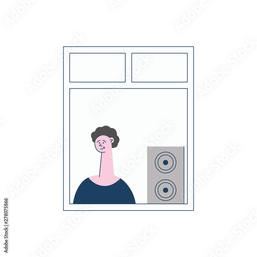 Curly man or boy brunet stands and windows and listens to music from a column or subwoofer