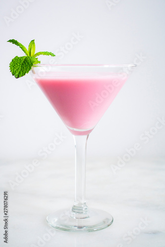 Pink Cocktail with a Mint Garnish