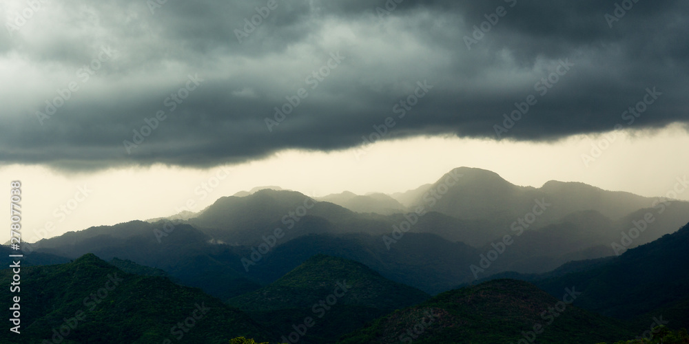 Landscape of mountains at sunset with clouds