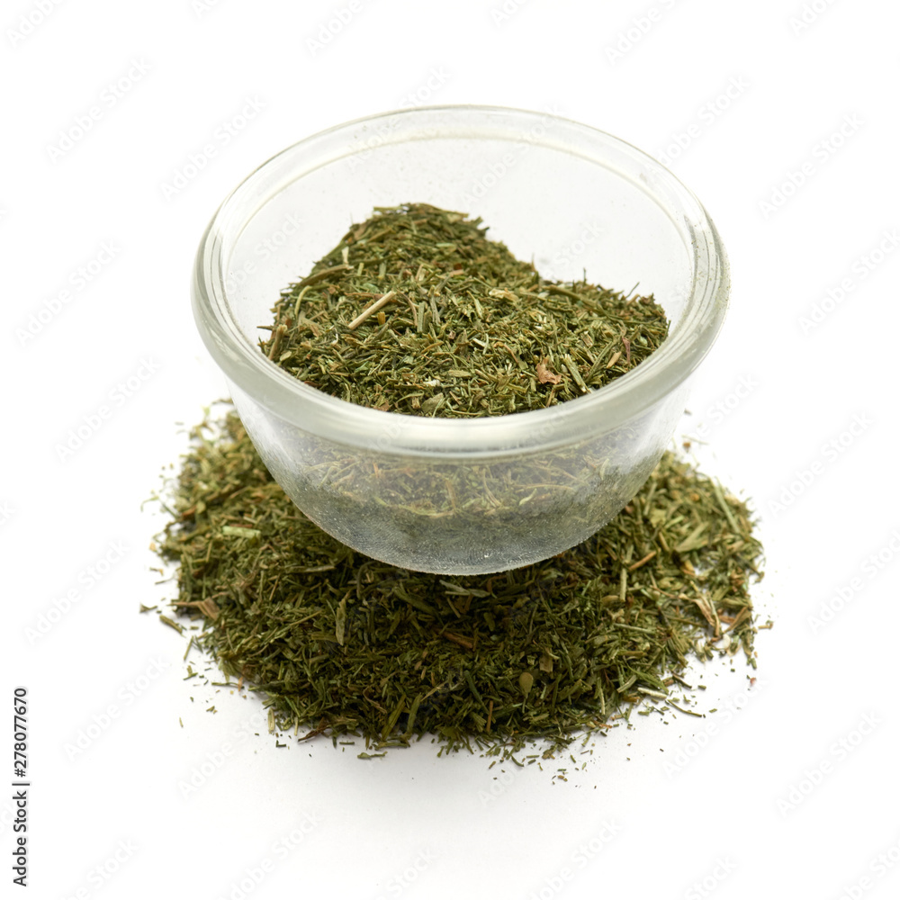 ground dill dried isolated in a glass plate ground dill dried isolated in a glass plate