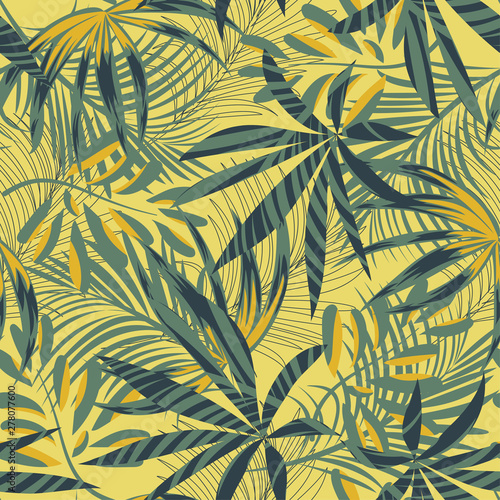 Summer abstract seamless pattern with colorful tropical leaves and plants on yellow background. Vector design. Jungle print. Floral background. Printing and textiles. Exotic tropics. Fresh design.