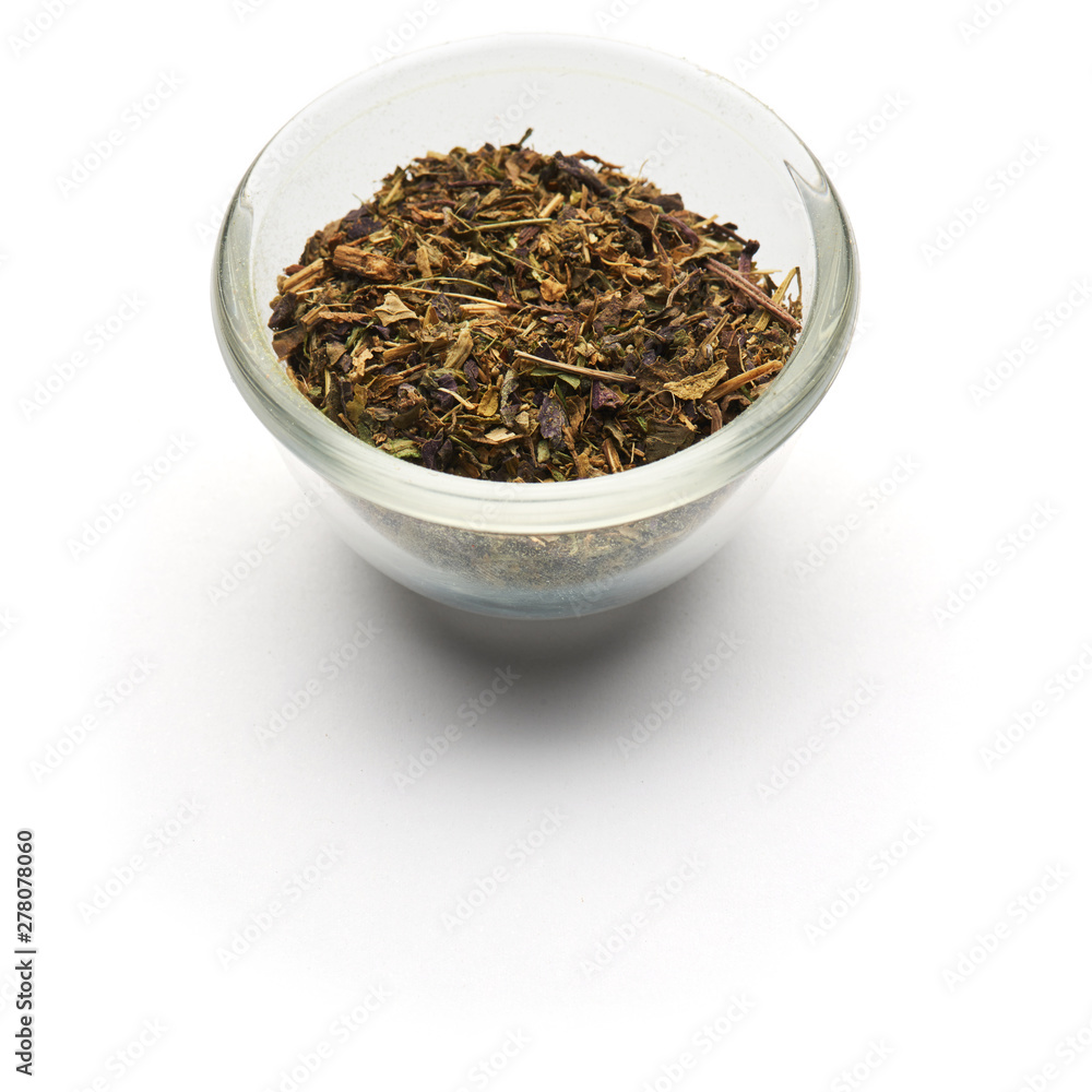 Fototapeta premium dried basil isolated in a glass plate