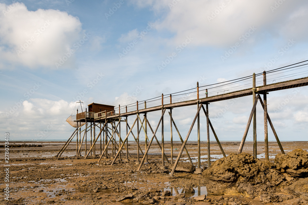 boardwalk made of wood on a beach near La Rochelle