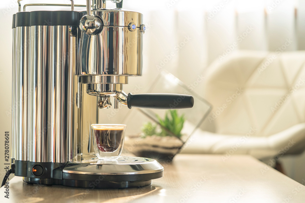 Coffee machine on table in sunlit room, home, office coffee brewing, appliances. Coffee machine on table in sunlit room, home, office coffee brewing, appliances.